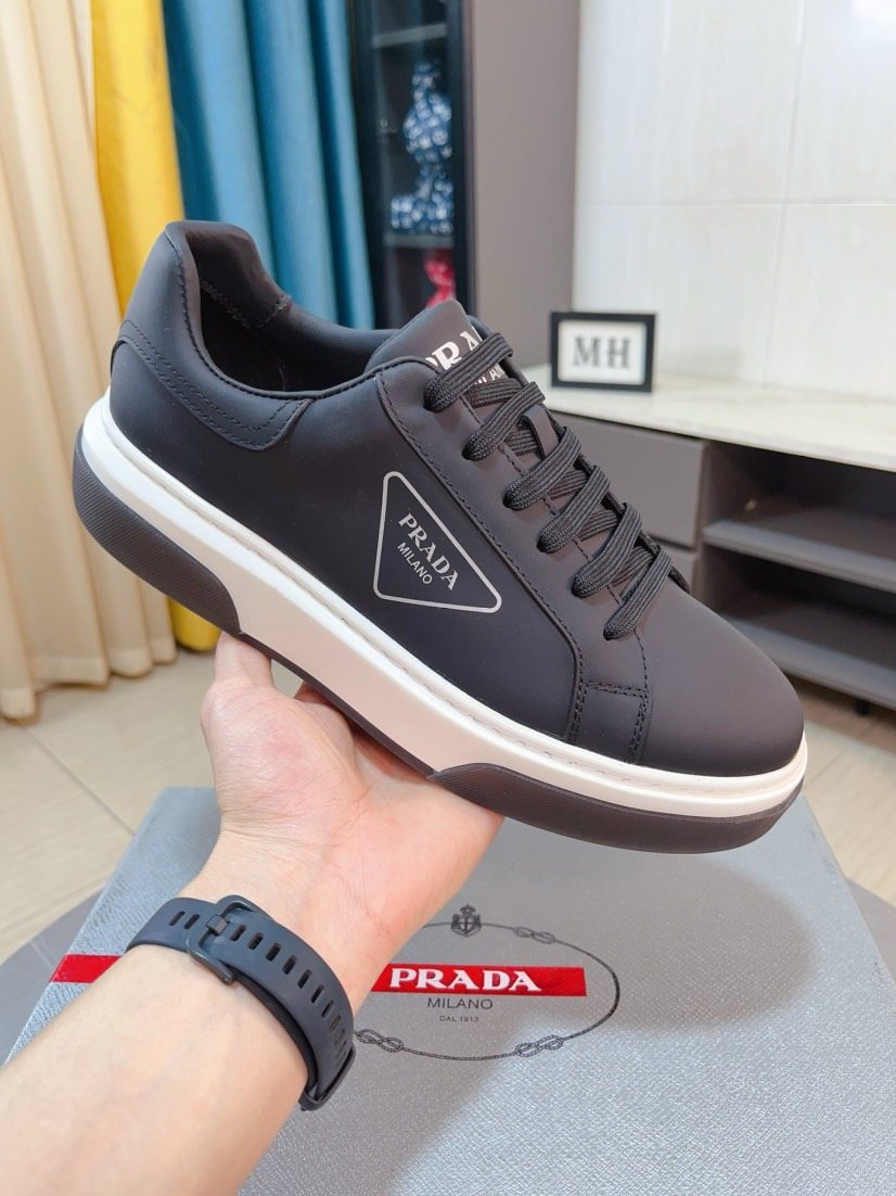 Prada Triangle Patch Low-Top Sneakers — model