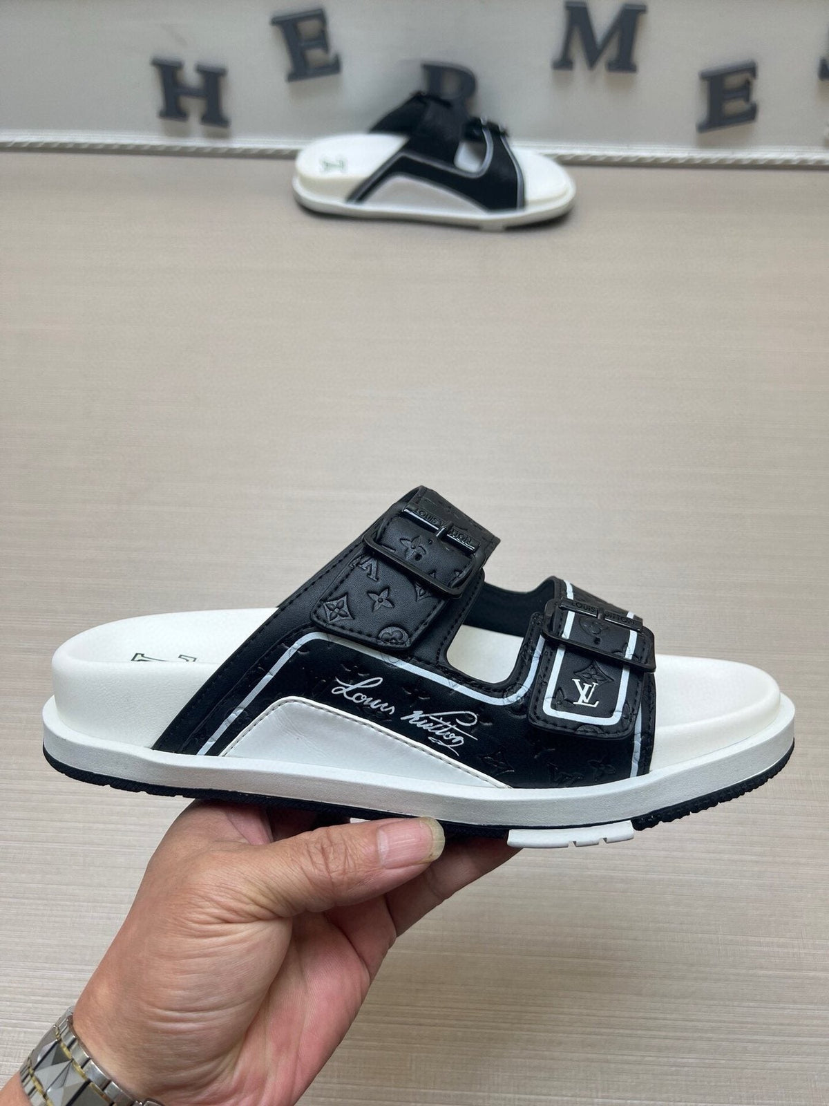 Louis Vuitton Double-Buckle Slide Sandals — model