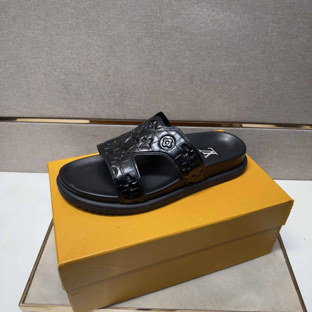 Louis Vuitton Textured Monogram Slide Sandals — front